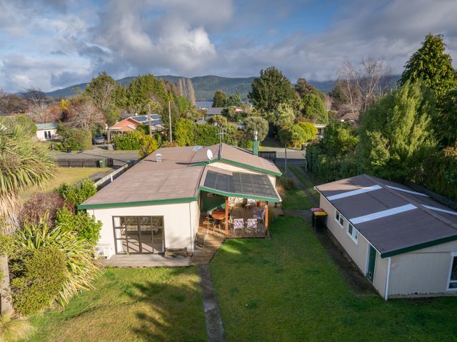 An aerial view of a house with a garden and solar panels at The Green House in 