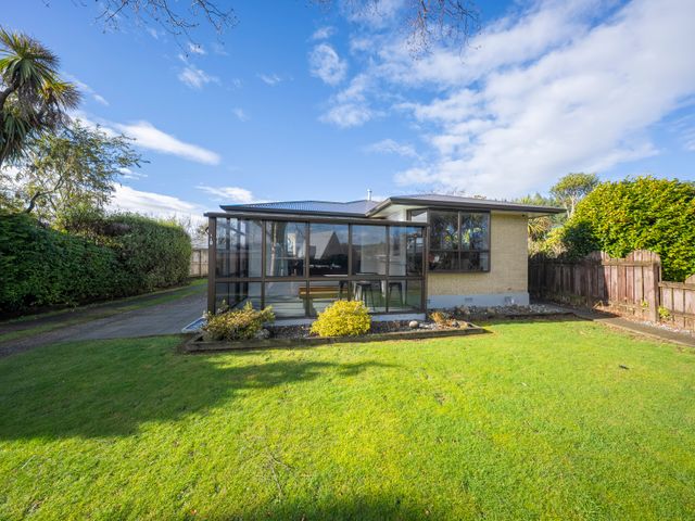 A house with a garden and pathway at Quiet on Quintin - Te Anau Holiday Home Te Anau