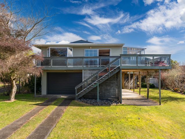 A house with a deck and garage at JOE'S Getaway - Omori Holiday Home, Omori