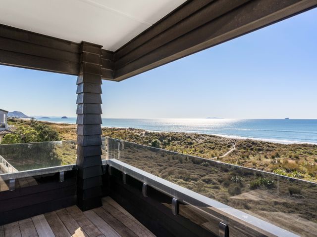 A balcony view overlooking the sea and landscape at Sunbrae Sands - Mount Maunganui Holiday Homes, Mount Maunganui