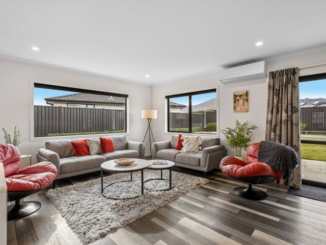 A living room with a sofa and coffee table at Hosking Haven - Cromwell Holiday Home, Cromwell