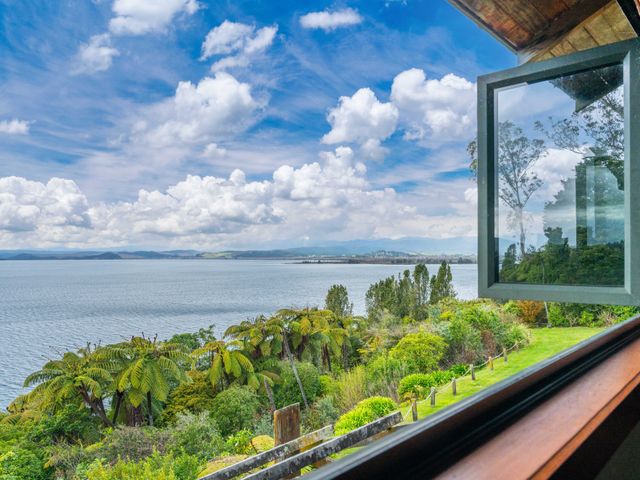 A view of water and trees from a window at Fern View - Pukawa Bay Holiday Home Pukawa Bay