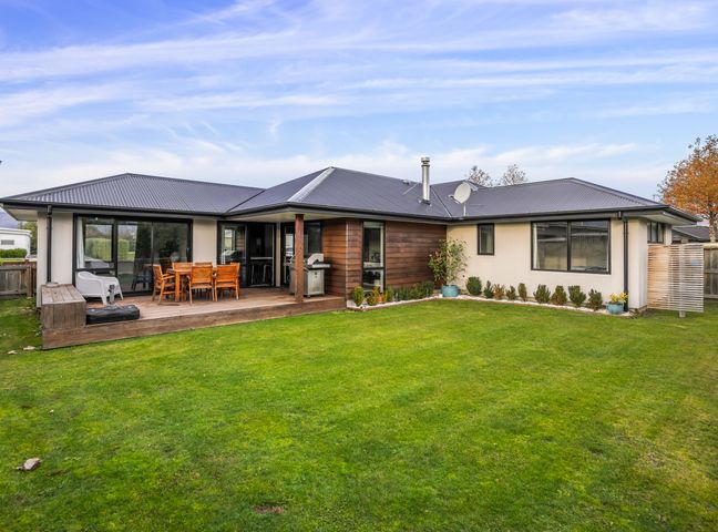 A house with a patio and lawn at Albert Town Wanaka Oasis - Wanaka