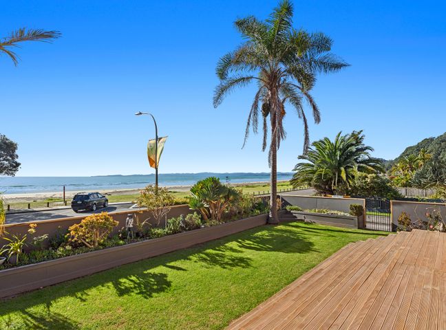 An outdoor area with a view of the beach and ocean at The Lights House - Beachfront Ohope Holiday Home Ohope