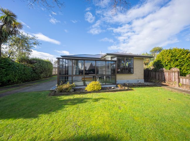 A house with a garden and pathway at Quiet on Quintin - Te Anau Holiday Home Te Anau