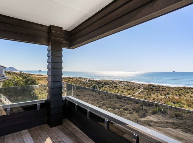 A balcony view overlooking the sea and landscape at Sunbrae Sands - Mount Maunganui Holiday Homes, Mount Maunganui