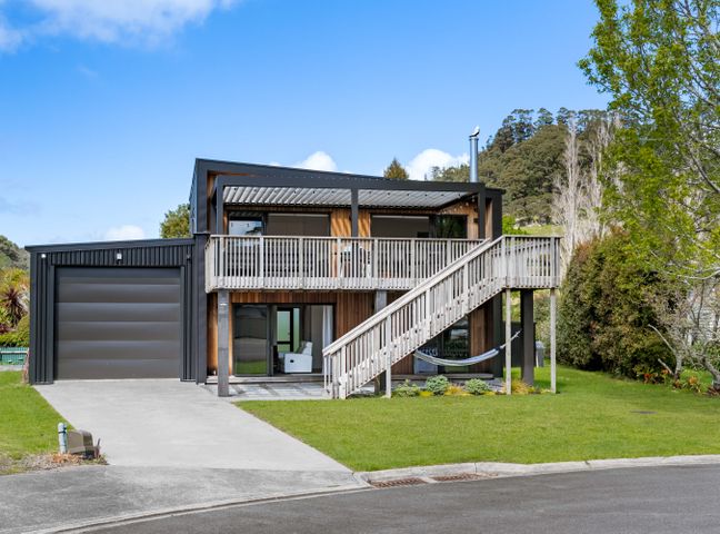 A house with garage and deck at The Cove Escape - Cooks Beach