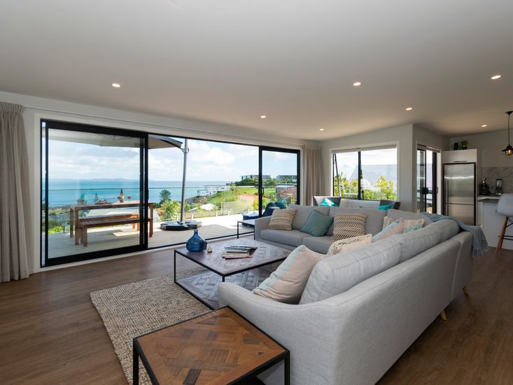 Open plan living area opens out onto the sundeck and views