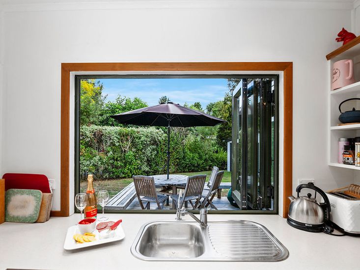 Kitchen window opens out to the BBQ