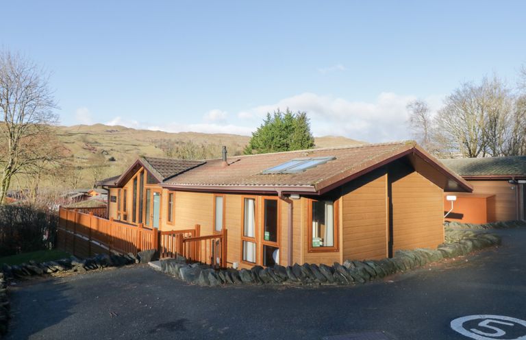 A house with windows and a fence at Heights View in