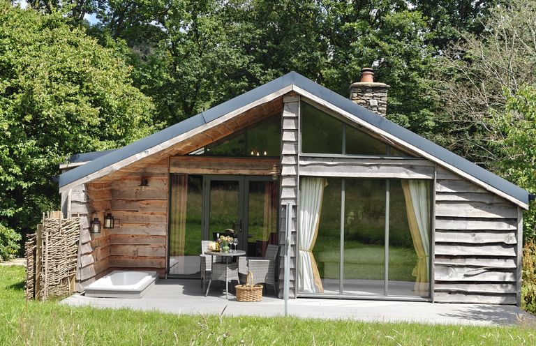 A house with a deck and a bathtub at The Hare's Shack in Garnett Bridge, Longsleddale. Near Kendal