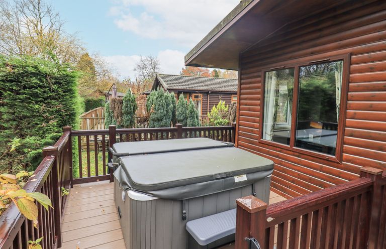 A hot tub on decking at Damson Lodge Thirlmere 8, White Cross Bay, Windermere