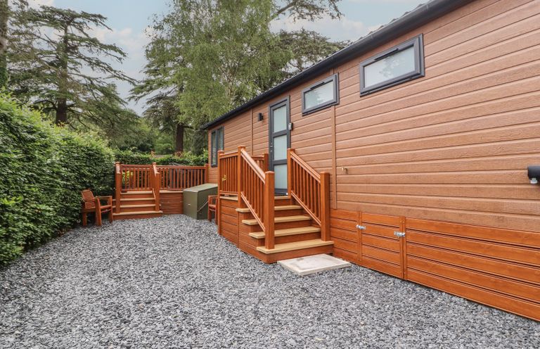 An outdoor area featuring a wooden deck and steps at Beech Grove Lodge Glade 17, Fallbarrow Park near Bowness on Windermere