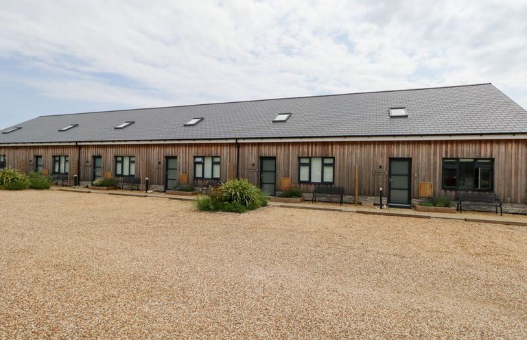 A building with multiple doors and windows at Egdon Heath, Nottington near Weymouth