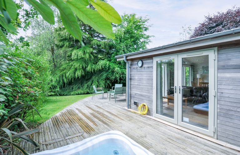 An outdoor area with a hot tub and deck at 15 Horizon View in Dobwalls