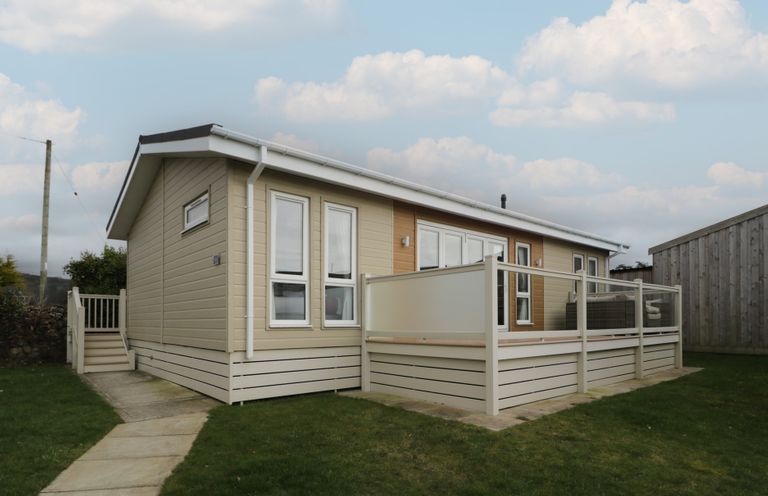 A house with a deck and garden at Platinum Lodge (503) Talybont
