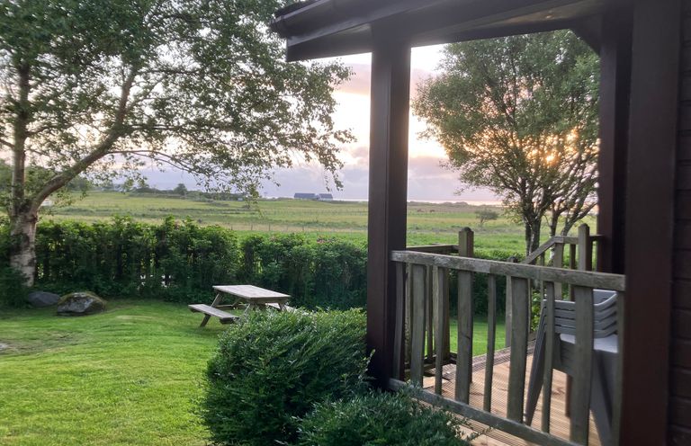 A view of a garden area with a picnic table at Island View Lodge Back of Keppoch near Arisaig