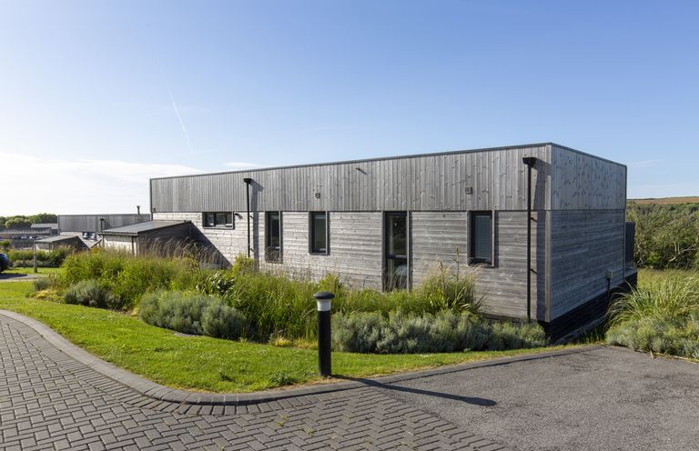 A modern building with landscaping at Dahlia in Portreath