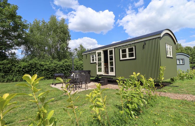 A cabin with outdoor seating area at Primrose in Grimsby
