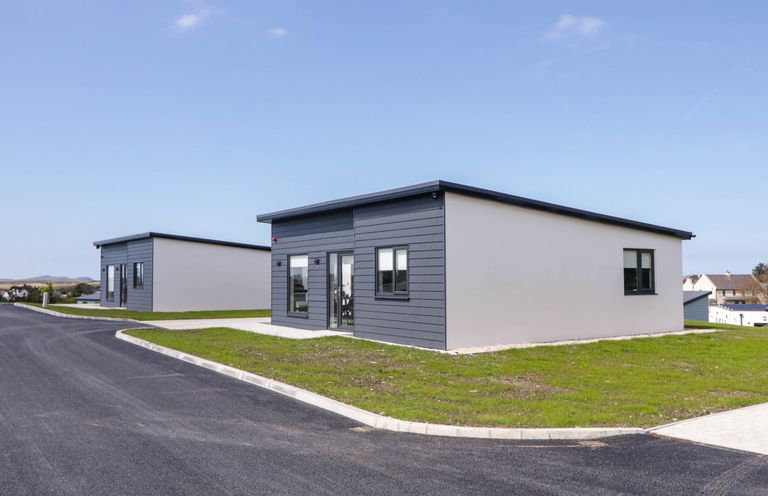 Two single story modern houses with paved driveways and grass lawns at Number 2 Villa - The View in Derrybeg County Donegal