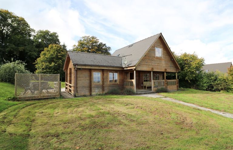 A wooden house with a garden at Dan Y Coed Beggar's Bush near Presteigne
