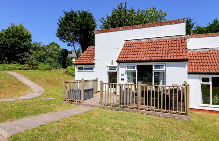 A bungalow with a deck and garden area at Boo’s Bungalow in Callington near Gunnislake