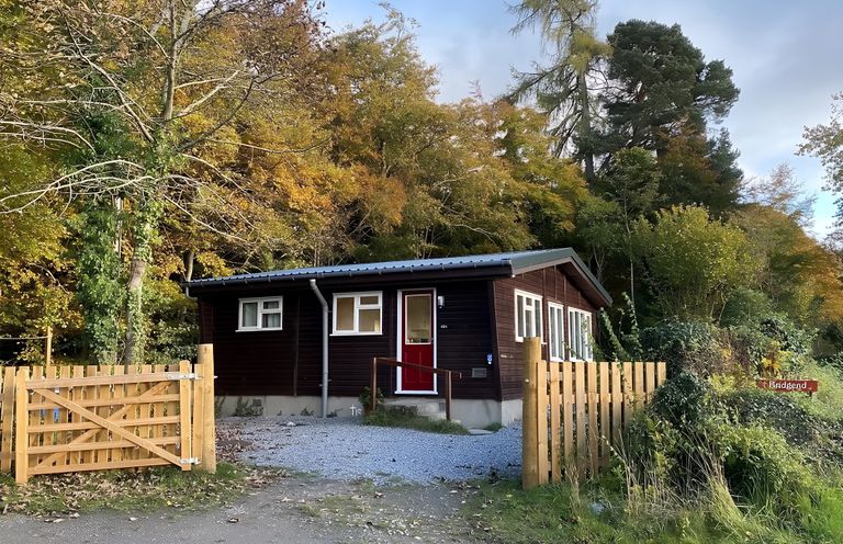 A house with a gate in front at a location in nature