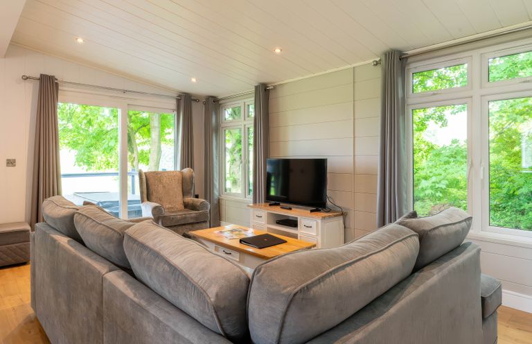 A living room with a sofa and television at Bainbridge in Leyburn