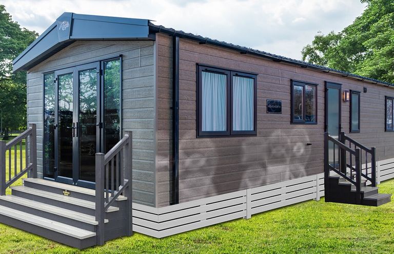 A static caravan with glass doors and steps at Redwood Waterside Spa, Carlton Miniott near Thirsk
