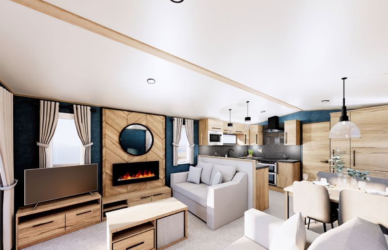 A living room with a sofa, tv, and coffee table at Willow Spa in Carlton Miniott near Thirsk