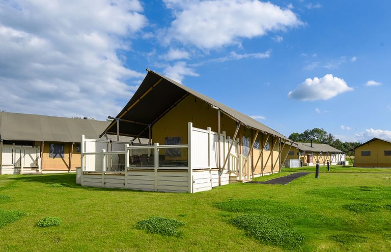 A group of tents with a deck in an outdoor setting at Kruger in Penrith