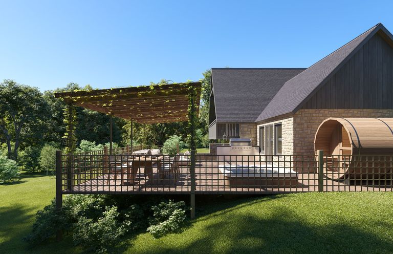 An outdoor area with a deck and seating at Heatherwood (Pet) Slaley