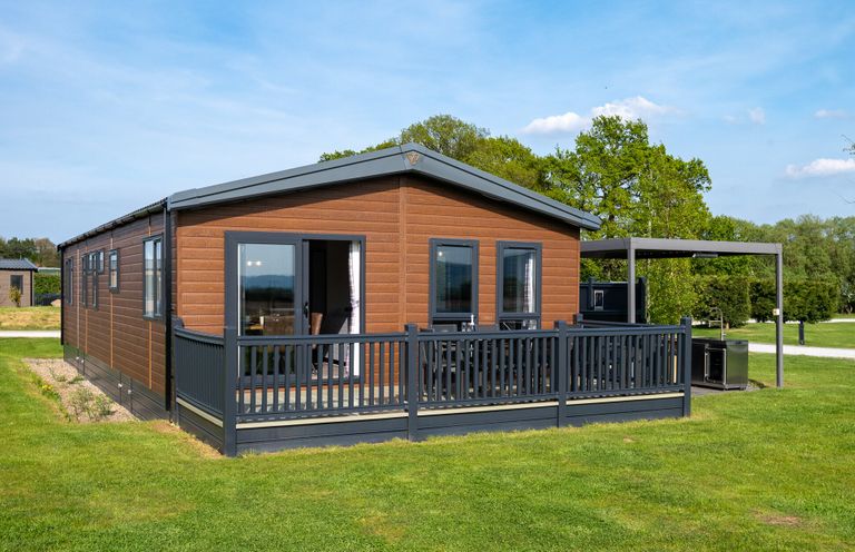 A cabin with decking and windows at Roseberry in Great Ayton