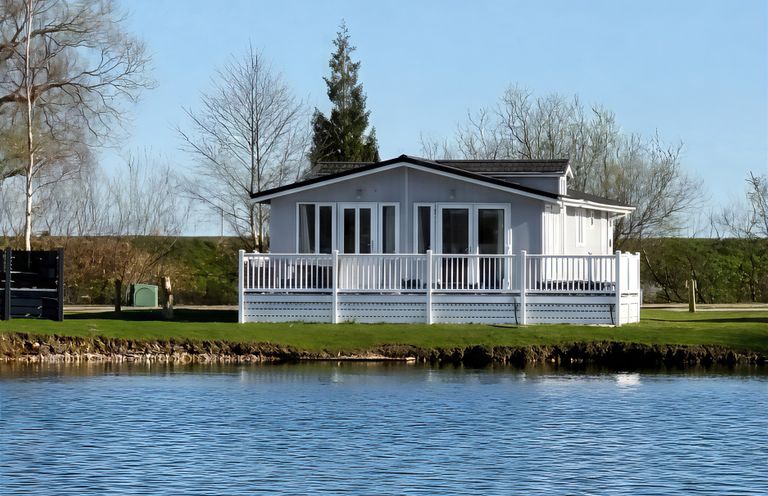 A house by a lake at Indulgence Fishing Lodge with Private Hot Tub in Tattershall