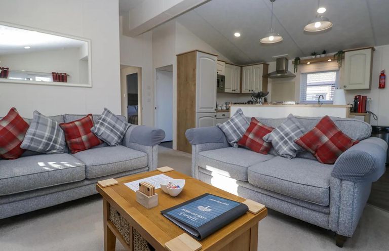 A living room with sofas and a coffee table at Lakeland Lodge 3Bed 2 Bath Private Patio Carnforth
