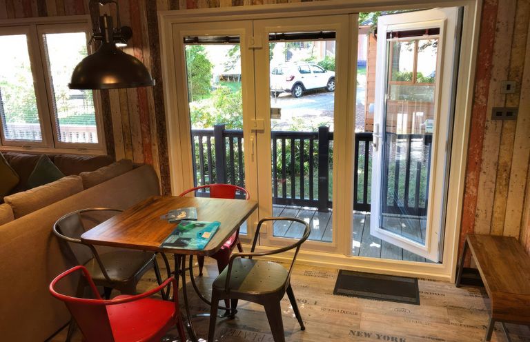 A dining area with a table and chairs at Sandy Balls Holiday Park Pet Friendly Lodge Godshill, Hampshire