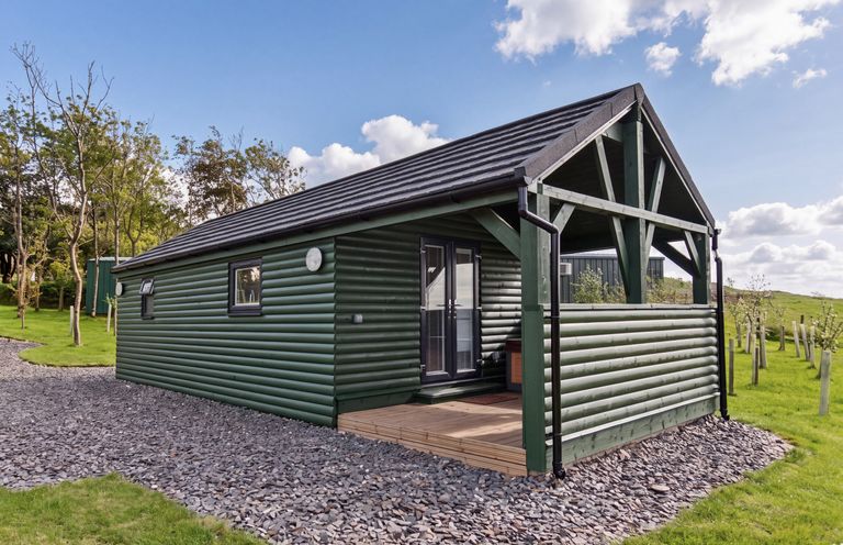 A house exterior with a deck at Ash Lodge in Pennington near Ulverston